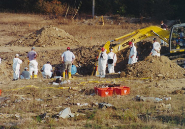 During the excavation of the Flight 93 crash site watchers were stationed around the pit, hoping to spot the bright orange color of the boxes.  